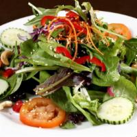 Bangkok Salad · Mixed greens, toasted cashew nuts, carrot, tomatoes, cucumbers tossed in a light soy sesame ...