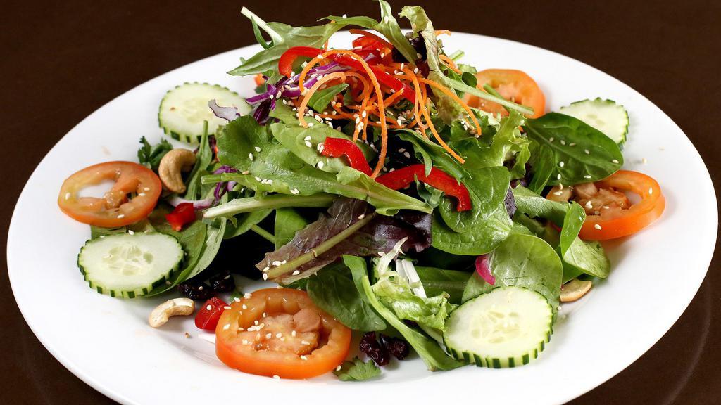 Bangkok Salad · Mixed greens, toasted cashew nuts, carrot, tomatoes, cucumbers tossed in a light soy sesame vinaigrette and topped with fresh cilantro.