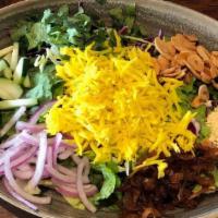 Mango Salad · Refreshing salad made with pickled mangoes, onions, cabbage, and cucumbers.
