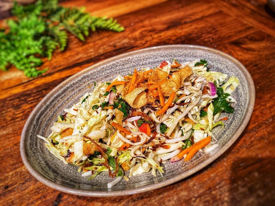 Superstar Noodle Salad · (room temperature and not available mild) Traditional Burmese noodles with bean thread noodles, tofu, cucumbers, potatoes, papaya, chili sauce, wonton chips, fried onions, cabbage & dried shrimp (or vegetarian)