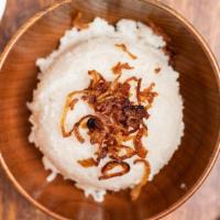 Coconut Rice · Coconut rice top with fried onions.
