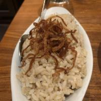 Brown Rice · Brown rice top with fried onions.