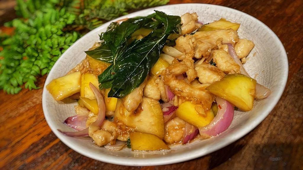 Mango Chicken · Stir fried chicken breast with fresh mangos and onions in a light chili sauce.Stir fried chicken breast with fresh mangos and onions in a light chili sauce.