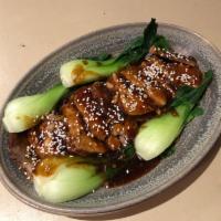 Braised  Pork Belly w/ Pickled Mustard Greens · Savory slices of tender pork belly in a sweet garlic and wine sauce.