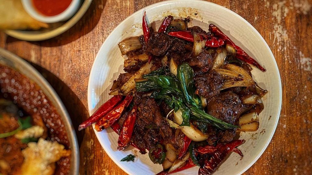 Chili Lamb · Not available mild. Stir fried lamb with dried and fresh chili, onion and basil.