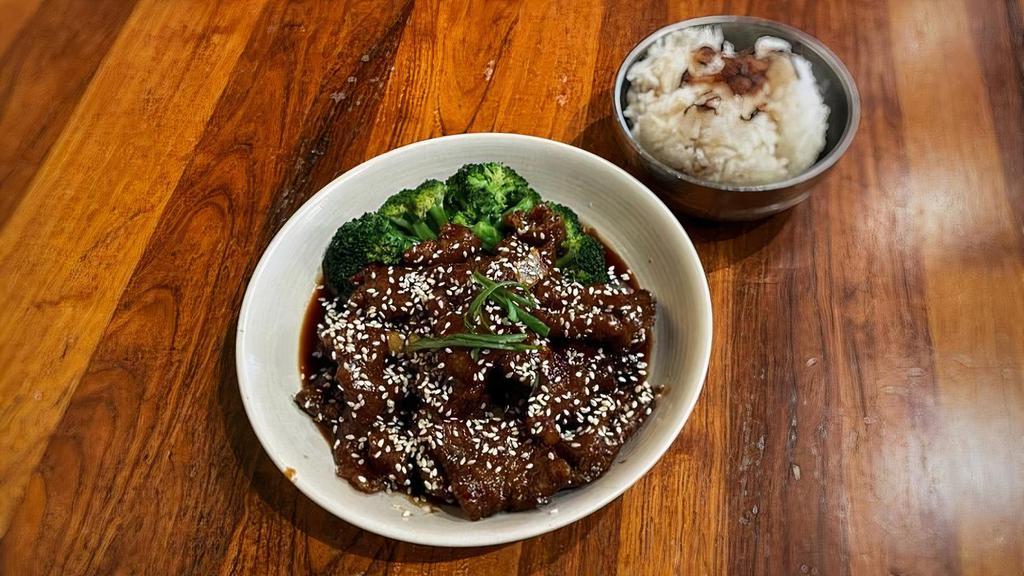 Sesame Beef · Strips of beef lightly battered & fried with a sweet & tangy sauce, topped with sesame seeds.