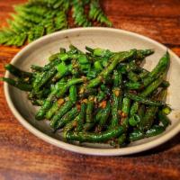 Dried Fried String Beans · Stir fried String Beans with garlic and chili sauce.