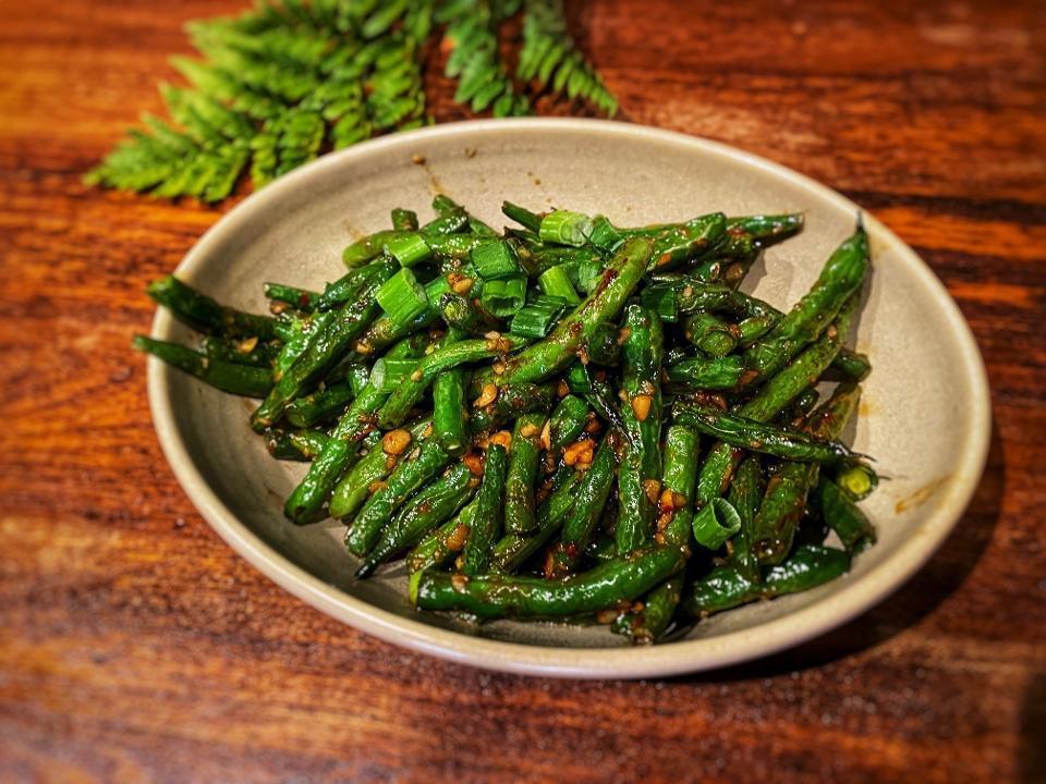 Dried Fried String Beans · Stir fried String Beans with garlic and chili sauce.