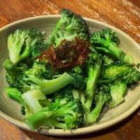 Wok Tossed Broccoli · Stir fried broccoli with wine and garlic, topped with fried onions.