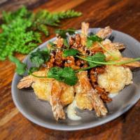 Walnut Shrimp · Shrimps lightly fried and tossed with a sweet sauce. Topped with roasted walnuts and sesame ...