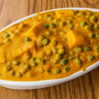Mater Paneer · Traditional cows' milk cheese and green pea curry.