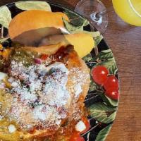 Huevos Rancheros · Two eggs, crispy corn tortilla, pinto beans, ranchero sauce, tomatillo salsa, cotija queso, ...