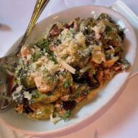 Roasted Brussels Sprouts · Cream, pancetta, shallots.