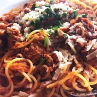 Spaghetti Bolognese · A rich Bolognese of veal, pork, and beef, fresh parmesan.
