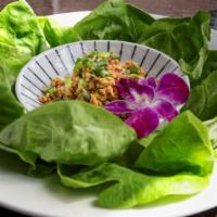 Chicken Lettuce Wrap · Wok-fried minced chicken with lava sauce red onion, cilantro, mint, lemongrass, served with ...