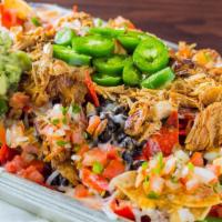Nachos  · Topped with shredded chicken or skirt steak, black beans, cheese - Served on the side - thin...