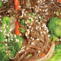 Soba Noodle · Buckwheat noodles, carrots, broccoli, onion, sesame seeds, and avocado slices.