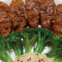 R5. Joyful Rice · Soy protein sauteed with slightly spicy lemongrass sauce served with broccoli and organic br...