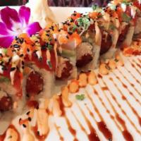 23. Discover
 · Spicy tuna, real crabmeat top with avo,tuna,yellowtail.