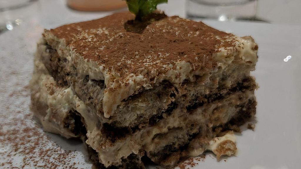 Tiramisu · Layers of lady fingers soaked in espresso filled with mascarpone cheese and shaved chocolate