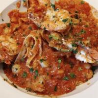 Fettuccine di Mare · Fettuccine with green mussels, shrimp, tilapia and scallops sautéed with garlic and marinara...
