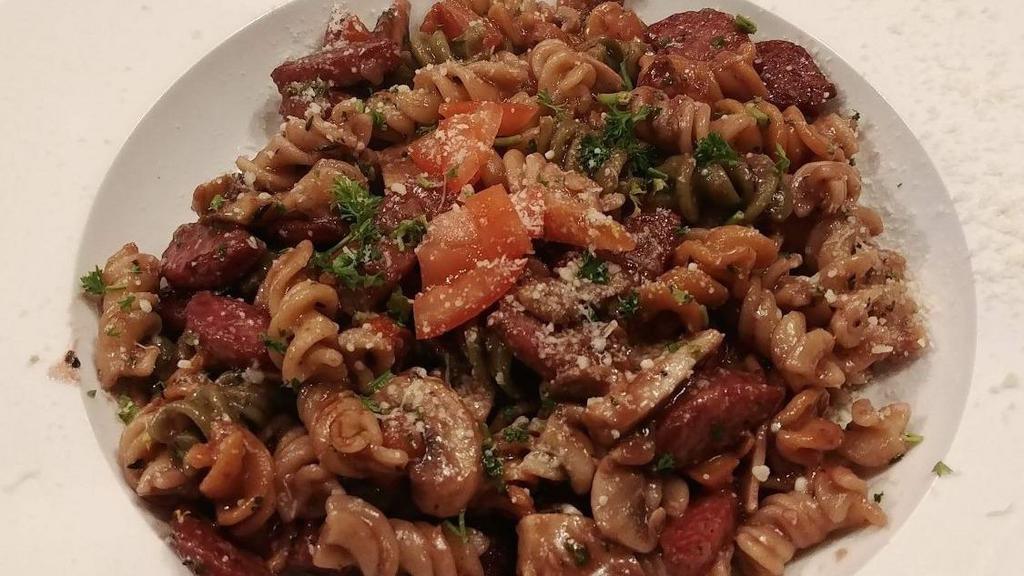 Fusilli · Tri-colored Fusilli with sautéed Italian sausage, mushroom, olives and tomato on red wine sauce