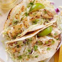 Fish Taco · Organic yellow corn tortilla, grilled salmon, cheese, pickled red and green cabbage, pico de...