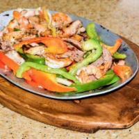 Mix Fajitas · Prawn, steak and chicken, fajitas, (grilled with onions, bell peppers, and tomato).