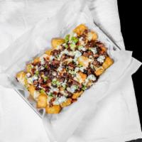 Tri Tip Tater Tot Nachos · White cheddar, tri tip, bacon, bleu cheese crumbles, green onions served over tater tots.