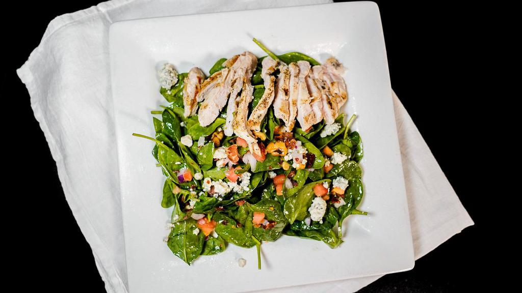 Spinach · Bacon, tomatoes, red onion, blue cheese crumbles, candied walnuts and Girard's® champagne dressing.