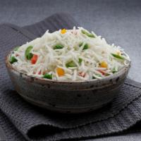 Pulao Rice · Traditional rice prepared with peas.