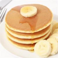 3 Fluffy Pancakes With Banana · 3 Perfectly cooked buttermilk pancakes, topped with fresh banana slices.
