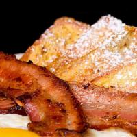 The French Toast Supreme · Three french toasts with two sausage links or three bacon strips or two sausage patties and ...