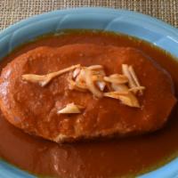 torta ahogada · refried beans, carnitas and spicy tomato salsa.