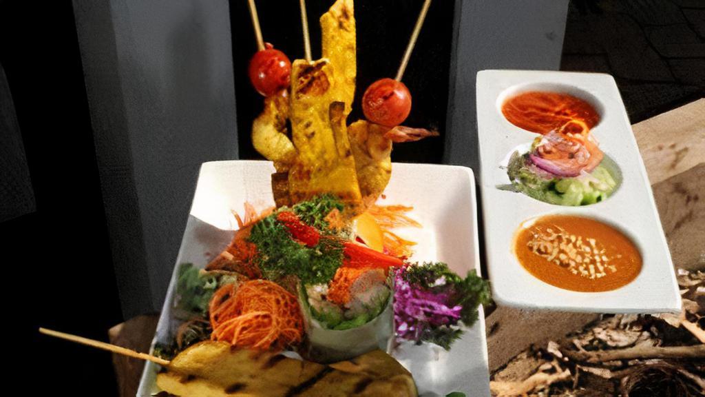 Tha Siam Appetizer Sampler (Appetizer) · Prawn satay two pieces, chicken satay two pieces, dumpling four pieces, and veg. Fresh roll two pieces served with cucumber salad and peanut sauce.