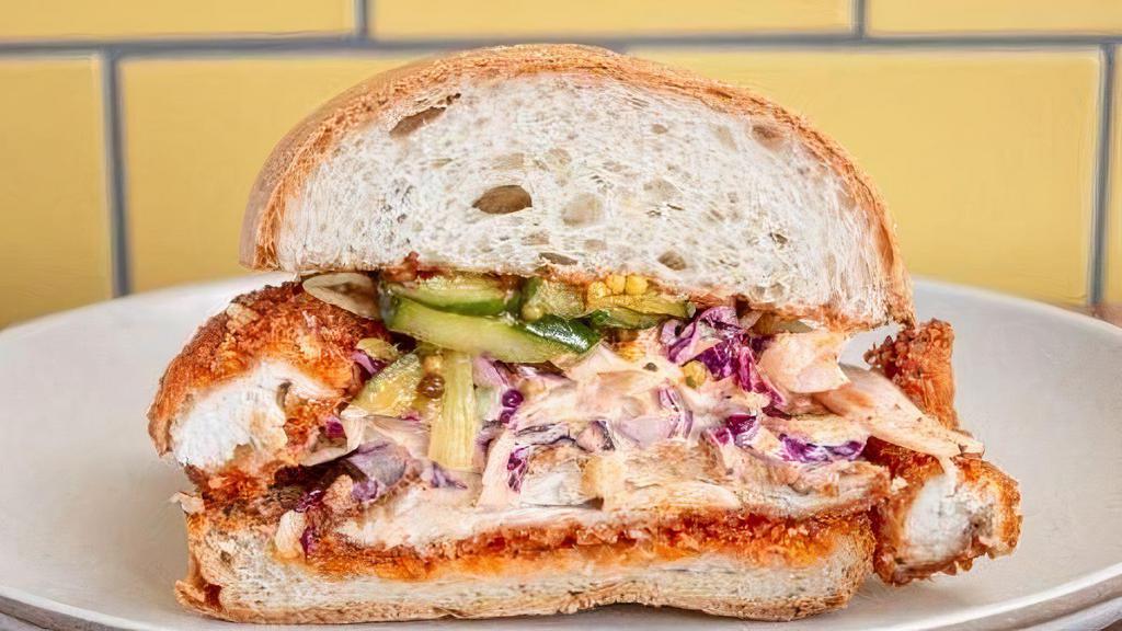The Hot · Mashup of Nashville & buffalo style, cabbage and carrot slaw,. first class sauce, and bread and butter. pickles