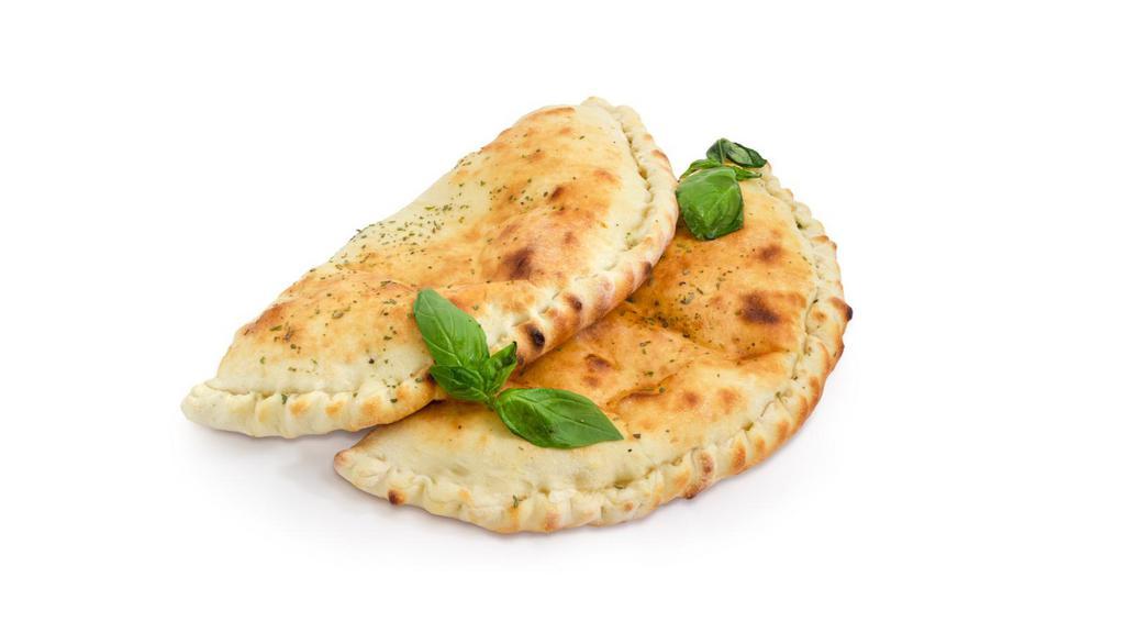 Mozzarella, Ricotta & Spinach Calzone · Our pizza dough, stuffed with fresh spinach and tons of mozzarella and ricotta cheese and baked to golden perfection.