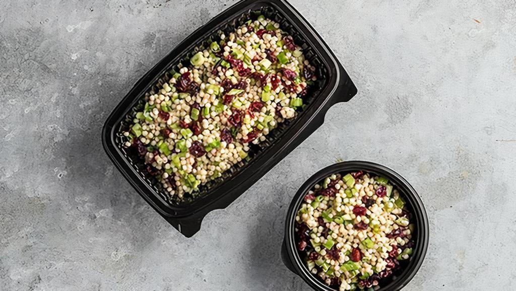Couscous Salad · Large couscous pearls, scallions, and dried cranberries seasoned with lemon pepper