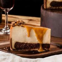 Brazilian Cheesecake · Creamy cheesecake and a layer of rich fudge atop a graham cracker crust
