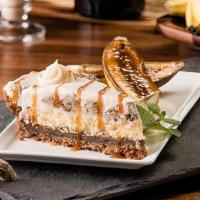  Bananas Foster Pie · Fresh banana pie made of lady finger cake and a layer of fudge atop a graham cracker crust