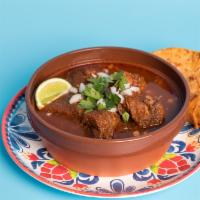 Traditional Birria bowl · Halal Beef Birria served in its own savory broth with onions, cilantro, and tortillas.