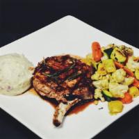 Pork Chop · With rosemary demi-glace served with mashed potato and roasted vegetables.