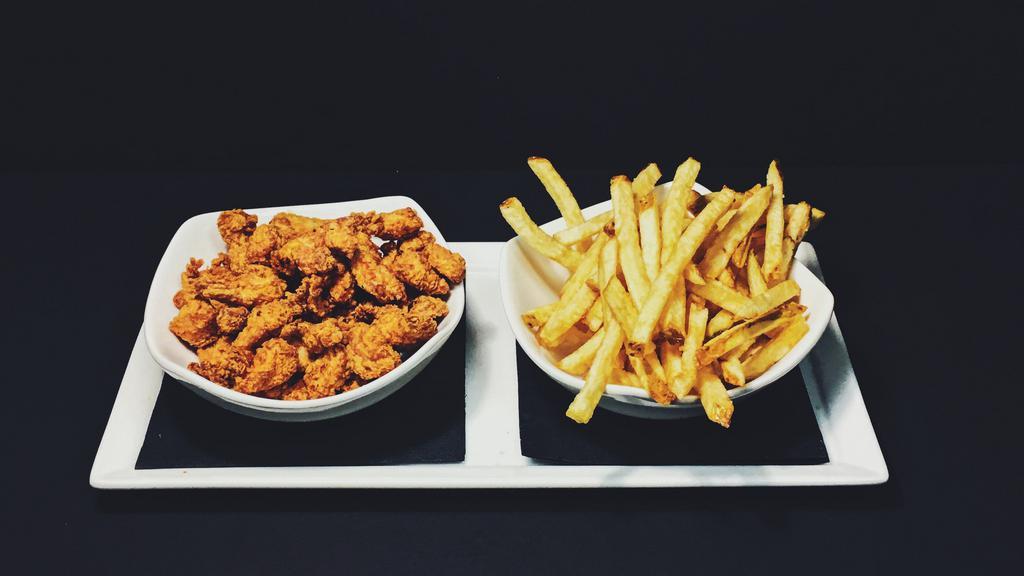 Crispy Popcorn Chicken · With a dipping sauce.