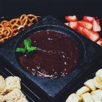 Chocolate Fondue · Ask your server for today's selection. Served with assorted fruit and dippers (serves 3-4).