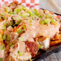 Gimme Fries · French fries topped with melted cheese, jalapeños and bacon bits.