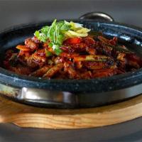 SQUID Dolpan Bokkem · Spicy sauteed SQUID  on hot stone plate.