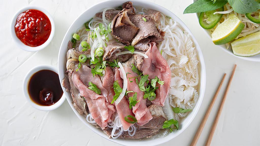 10. Phở Đặc Biệt · beef noodle soup with rare* sliced eye round steak, meatball, flank, well done brisket, tripe, tendon