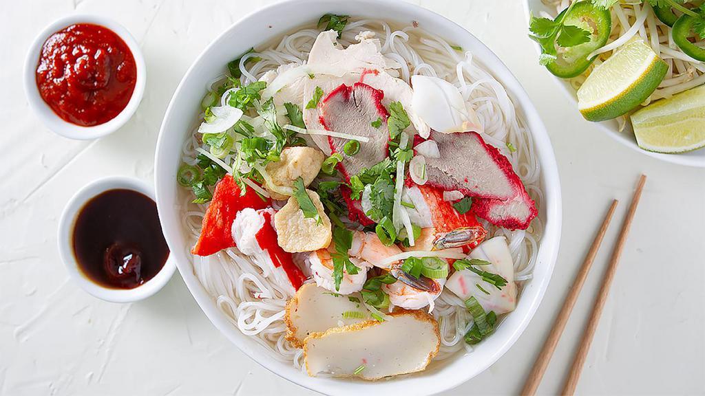 51. HỦ TIẾU ĐẶC BIỆT · thin rice noodles with barbequed pork, chicken, shrimp, imitation crab, squid, fishcake, fishball