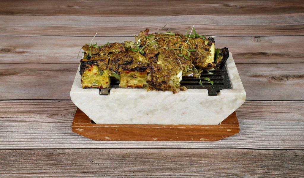*Hazari Paneer Tikka · Cottage cheese marinated in hung yogurt and topped with onion, garlic, chilies and coriander, barbecued in a clay oven