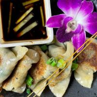 Mushroom Dumpling · Pan grilled dumpling, stuffed with shiitake mushroom, and chive, served with ginger sauce.